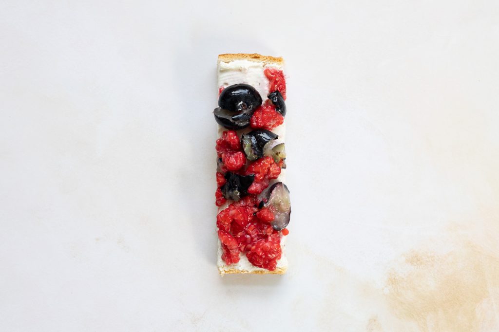 Berries with cream cheese on toast.