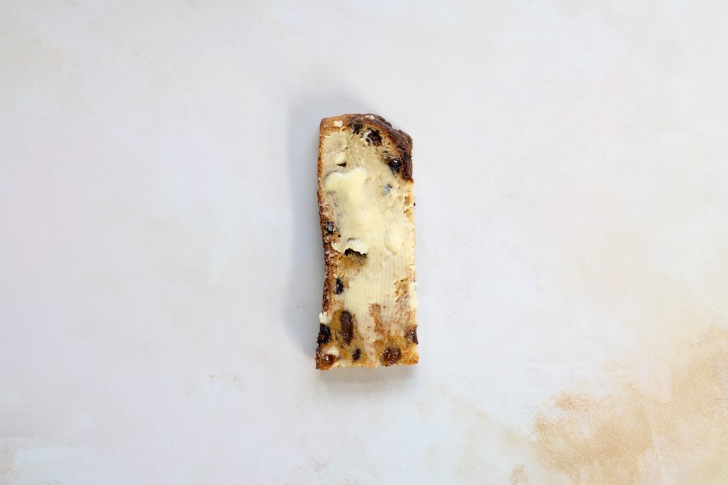 Unsalted butter on fruit toast.