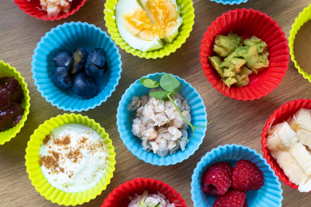 Different toast toppings in silicone cups.